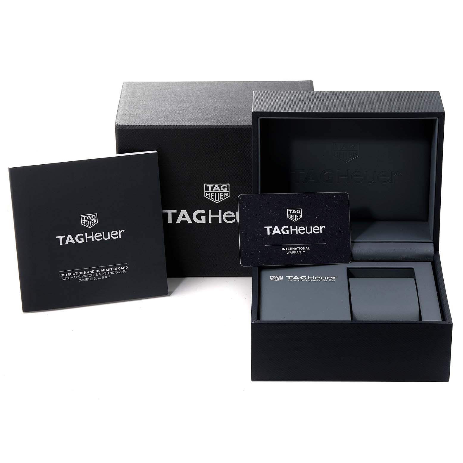 The image shows the packaging, warranty card, and instruction manual for a Tag Heuer Aquaracer WBP201A.BA0632 Men's Stainless Steel Black Dial WBP201A.BA0632 Men's Stainless Steel Black Dial watch.