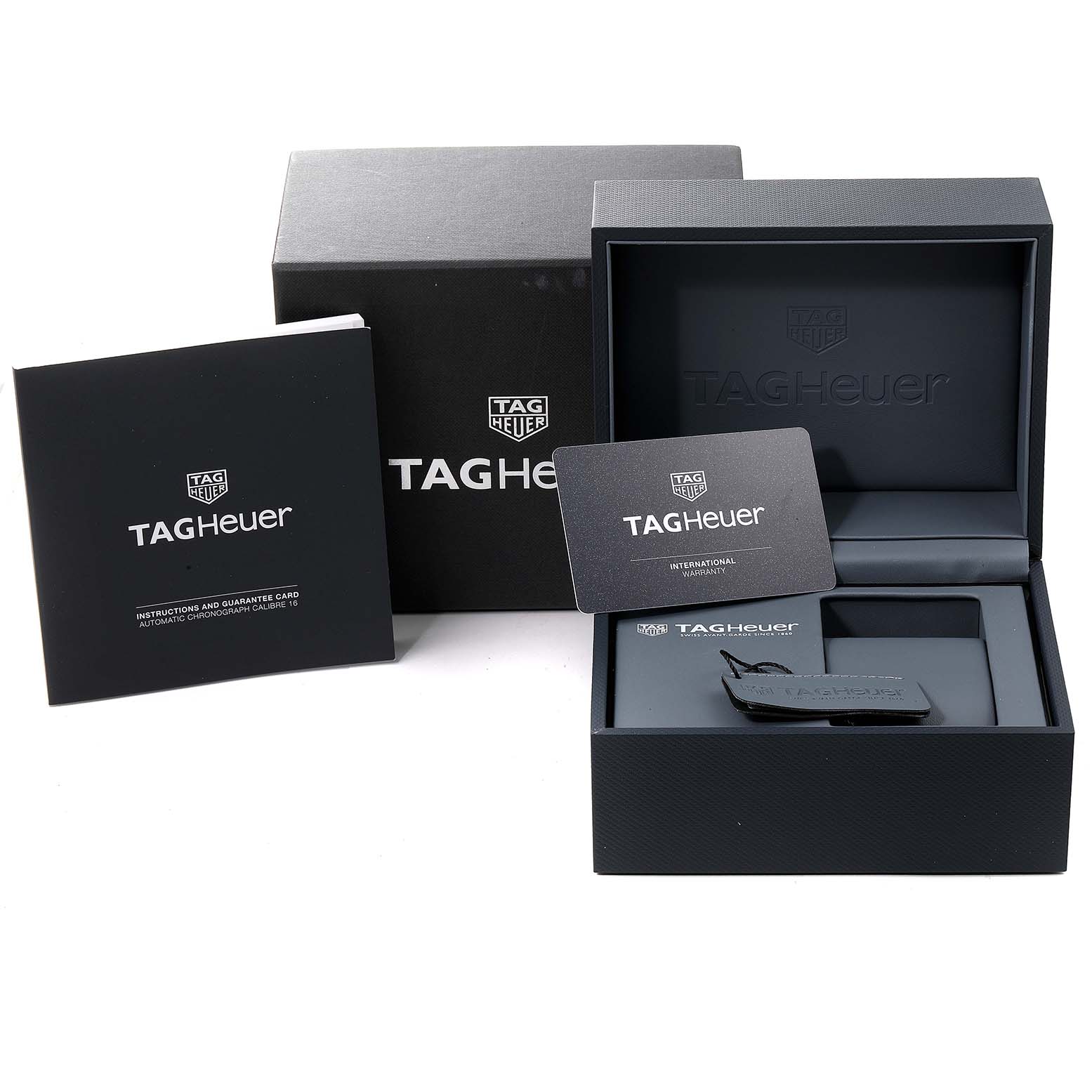 The image shows the packaging, instruction manual, international warranty card, and tag of a Tag Heuer Carrera CV2A1V.BA0738 Men
s Stainless Steel Blue Dial CV2A1V.BA0738 Men
s Stainless Steel Blue Dial watch.