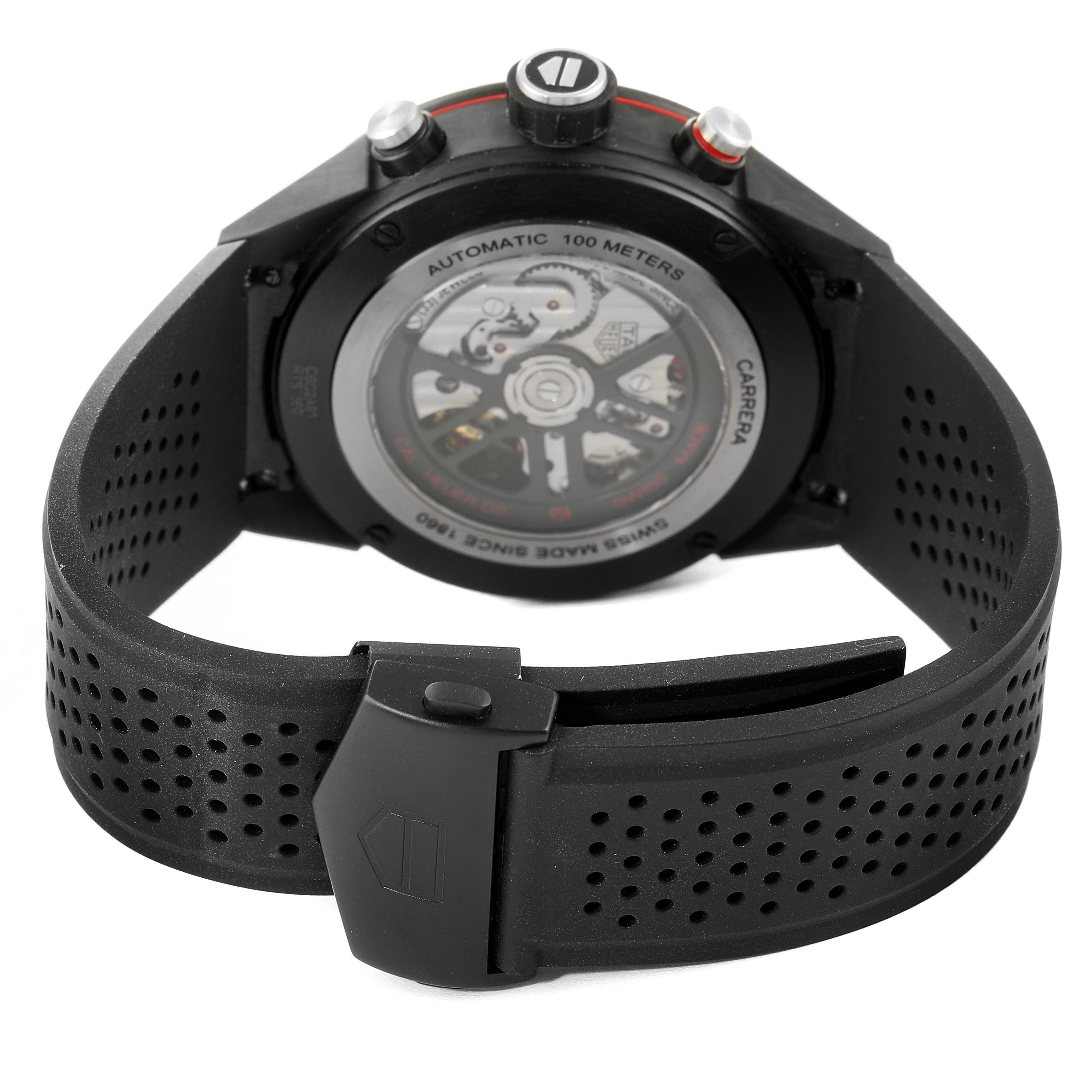The image shows the back view of a Tag Heuer Carrera CBG2A91.FT6173 Men's Ceramic Black Dial CBG2A91.FT6173 Men's Ceramic Black Dial model watch, focusing on its automatic movement and perforated strap.