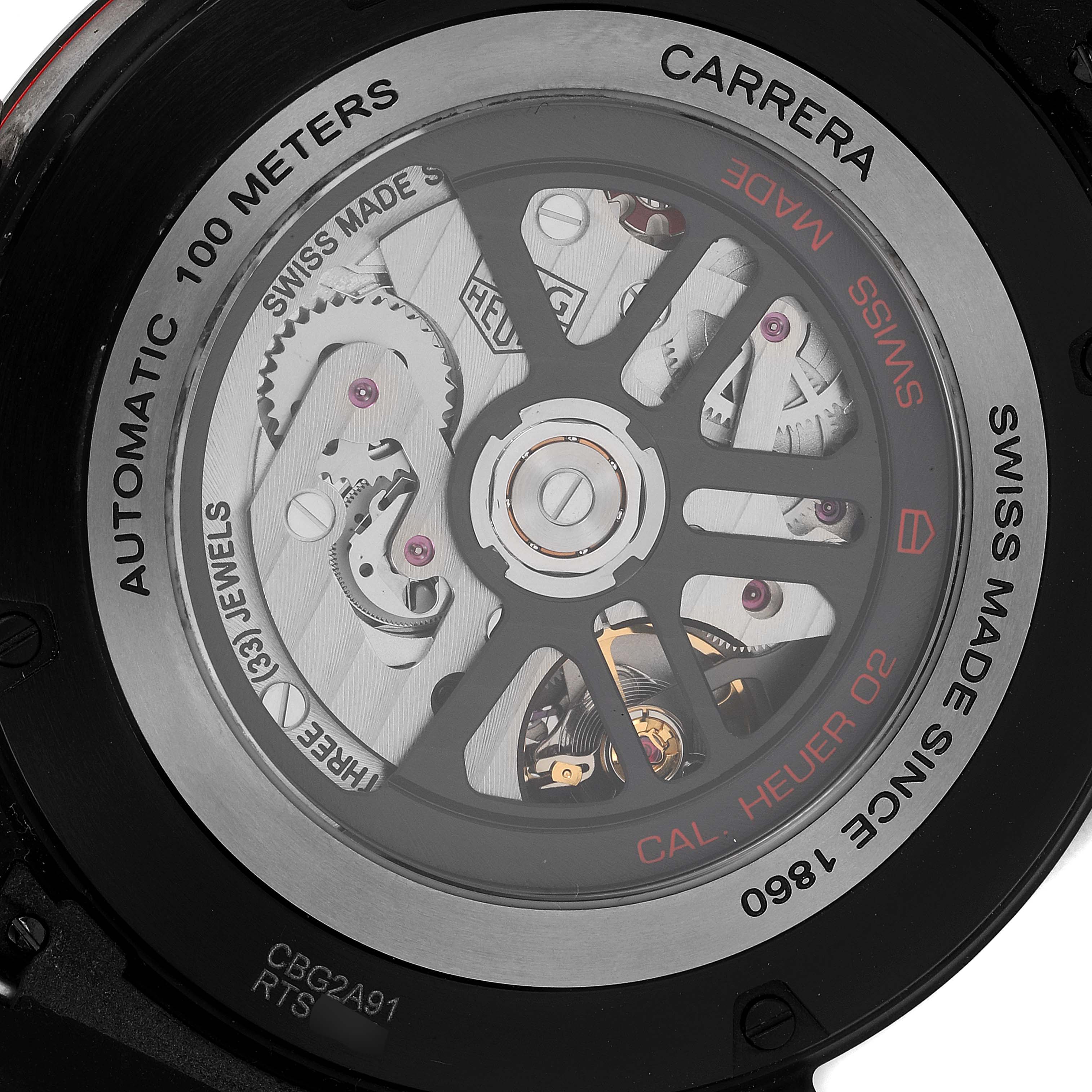 The image shows the back view of the Carrera model by Tag Heuer, highlighting the automatic movement and internal mechanics.