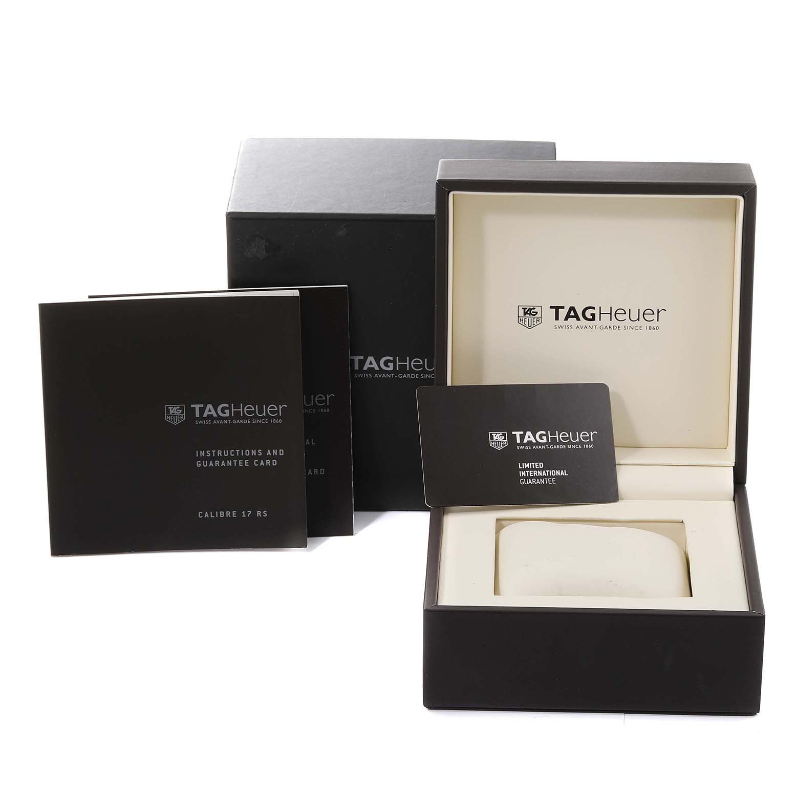 The image shows the packaging and accessories for a Carrera model by Tag Heuer, including the box, instruction booklet, and guarantee card.