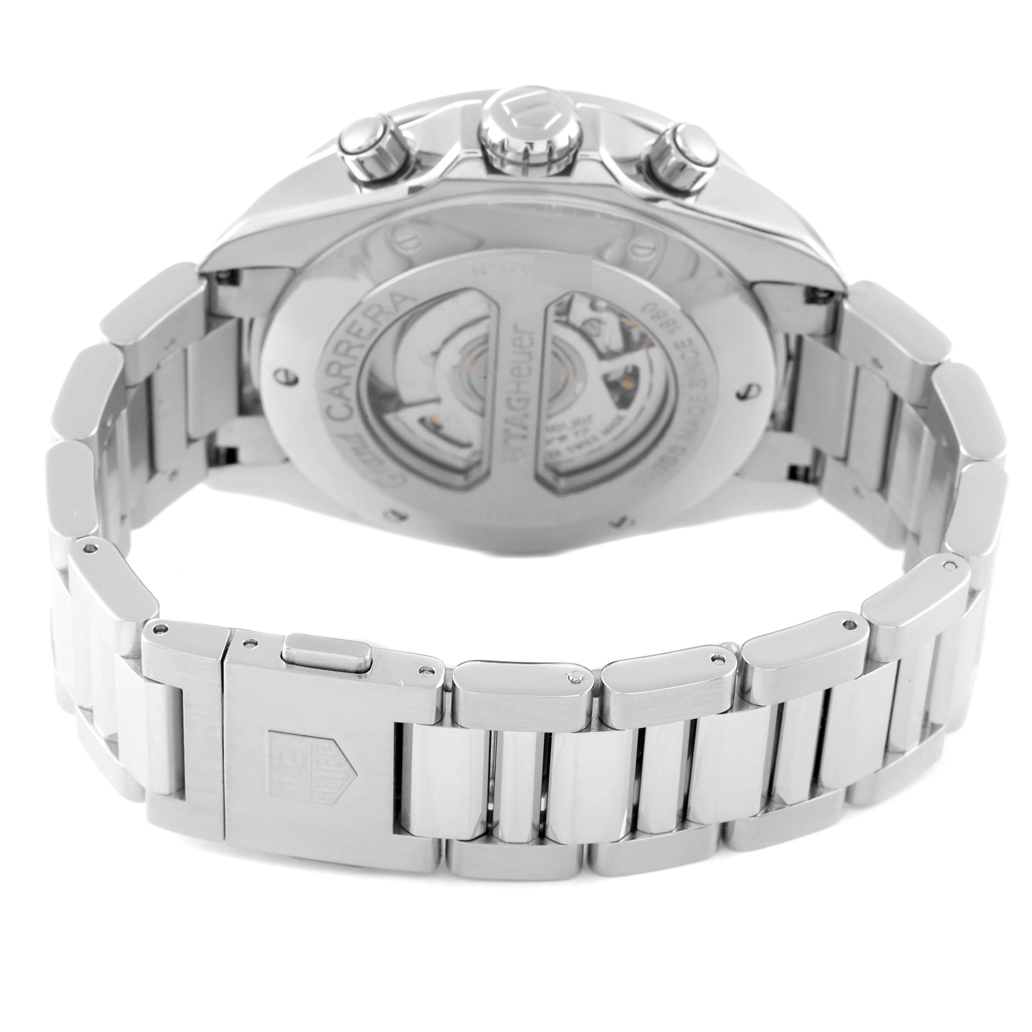 The image shows the back and partially sides of a Tag Heuer Carrera CAV511G Men's Stainless Steel Black Dial CAV511G Men's Stainless Steel Black Dial watch, featuring its stainless steel bracelet and visible movement through the case back.