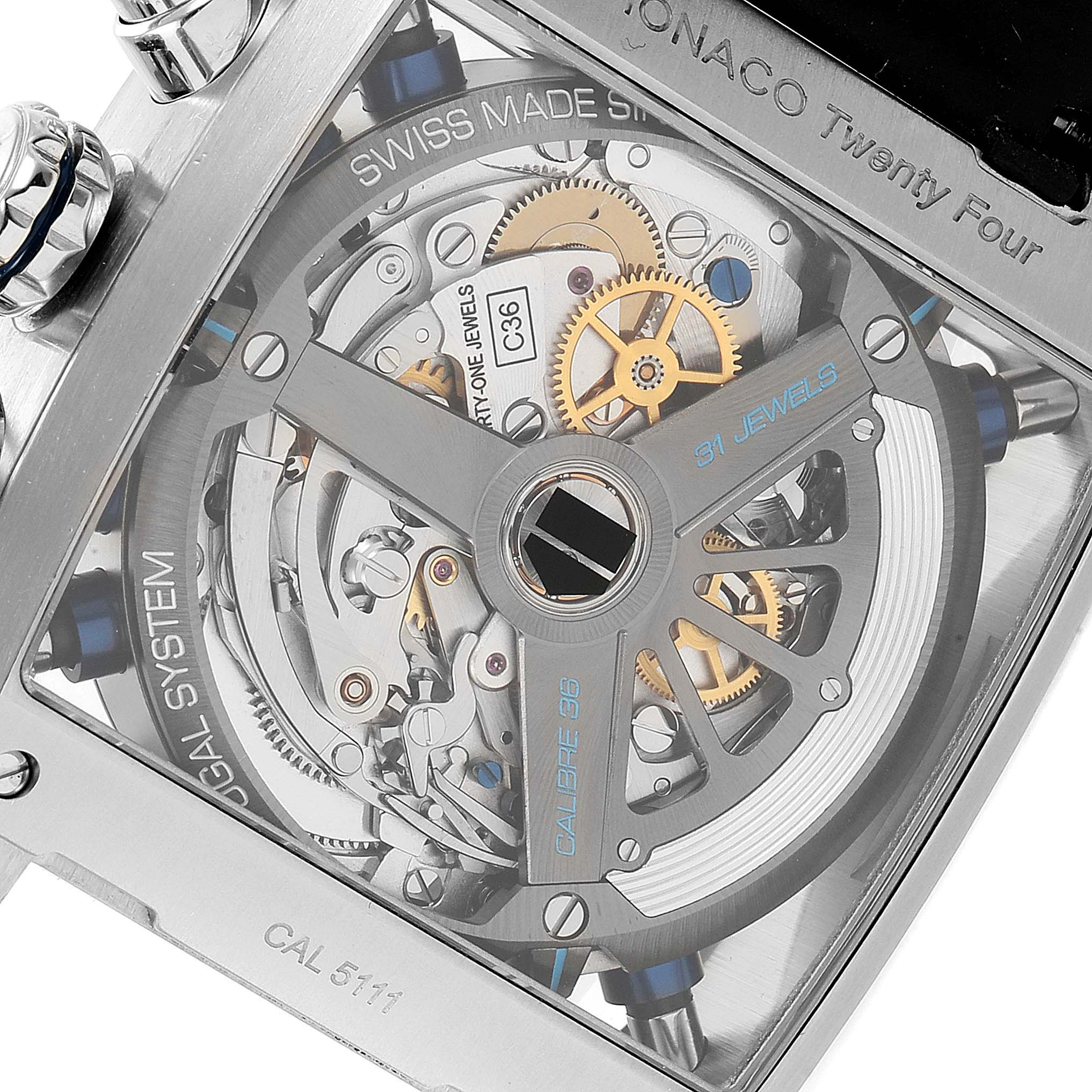 The image shows the intricate back view of the Tag Heuer Monaco CAL5111.FC6299 Men
s Stainless Steel Blue Dial CAL5111.FC6299 Men
s Stainless Steel Blue Dial model, highlighting its movement and internal mechanisms.
