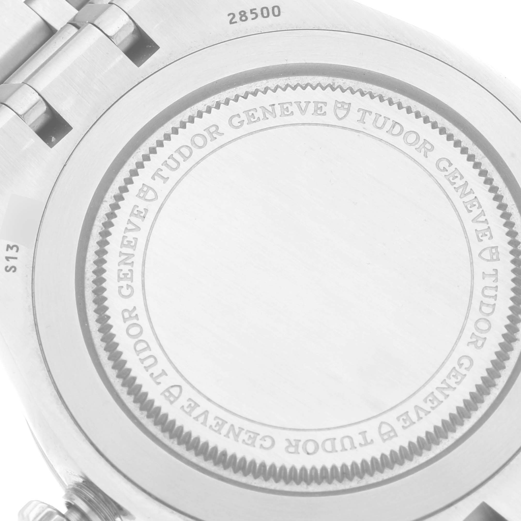 This image shows the back casing and part of the bracelet of a Tudor Royal M28500 Men
s Stainless Steel Silver Dial M28500 Men
s Stainless Steel Silver Dial watch, displaying the branding and model number.