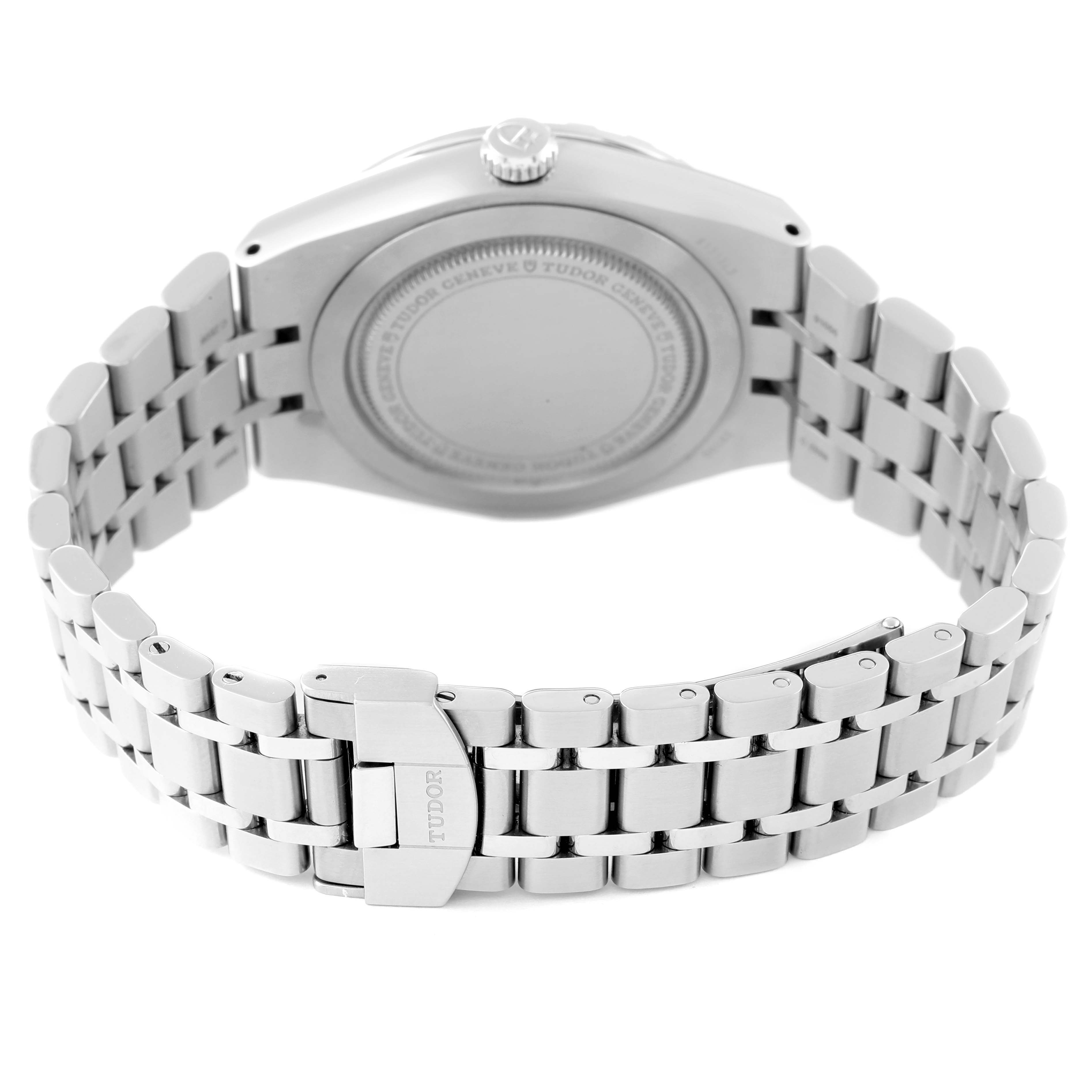 The image shows the back view of a Tudor Royal M28500 Men
s Stainless Steel Silver Dial M28500 Men
s Stainless Steel Silver Dial model watch, highlighting its case back, crown, and metal bracelet.