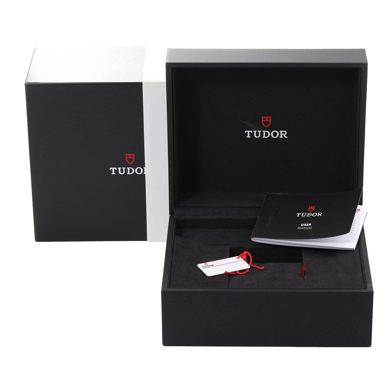The image shows the opened packaging of a Tudor Royal M28500 Men
s Stainless Steel Silver Dial M28500 Men
s Stainless Steel Silver Dial watch, including the box, manual, and hang tag.