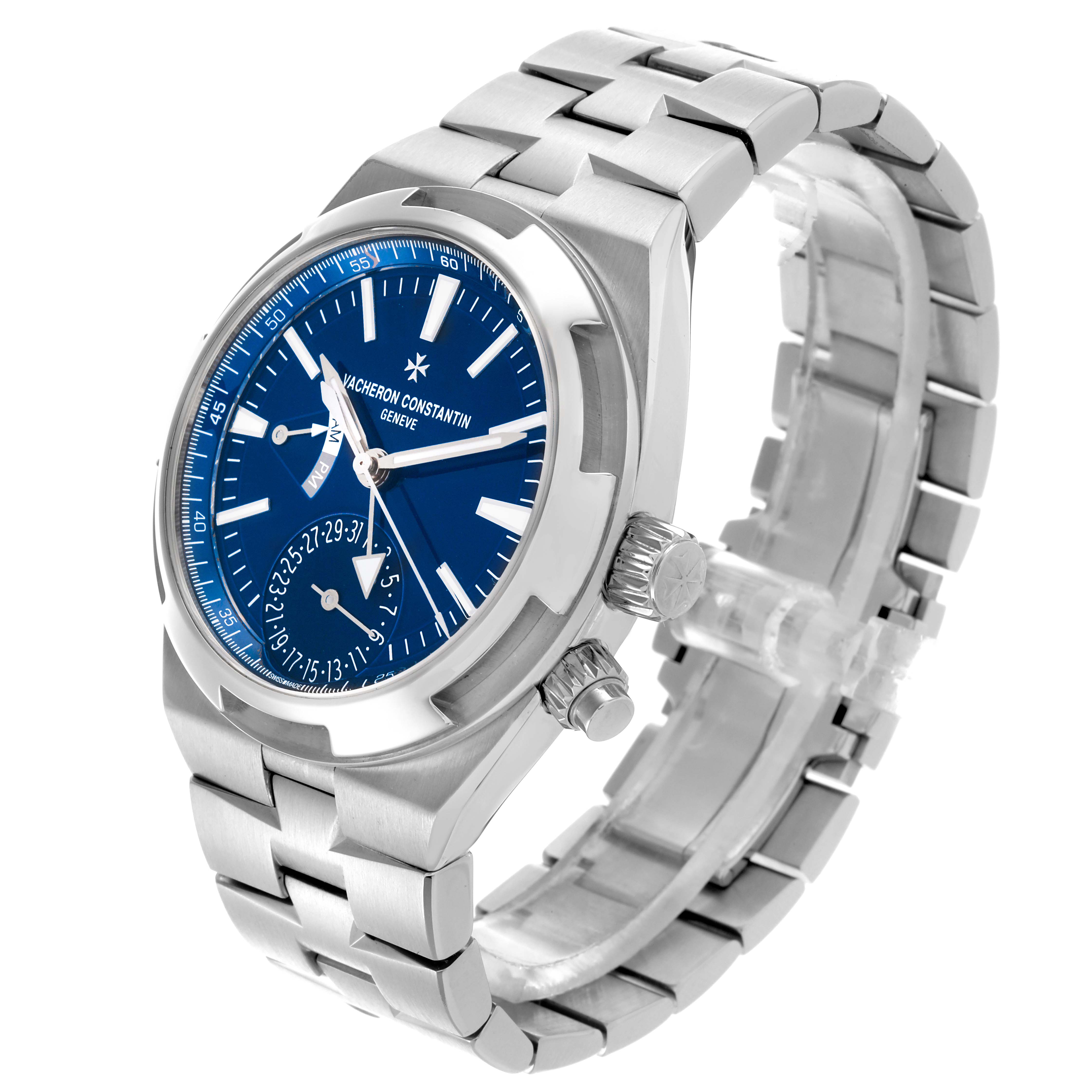 The Vacheron Constantin Overseas 7900V/110A-B334 Men's Stainless Steel Blue Dial 7900V/110A-B334 Men's Stainless Steel Blue Dial watch is shown at a three-quarter angle, displaying the blue dial, bracelet, and crown.