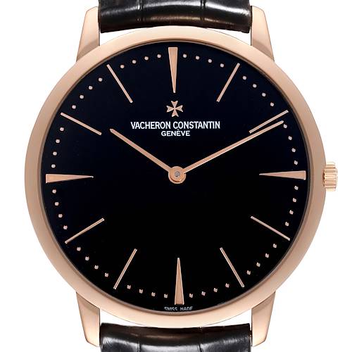 The Vacheron Constantin Patrimony watch is shown from a front angle, highlighting its face, case, crown, and leather strap.