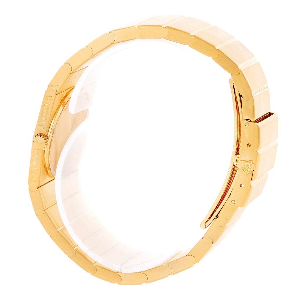 The image shows a side view of the gold bracelet of a Rolex Cellini Women's Yellow Gold Champagne Dial Women's Yellow Gold Champagne Dial watch, highlighting the clasp and links.