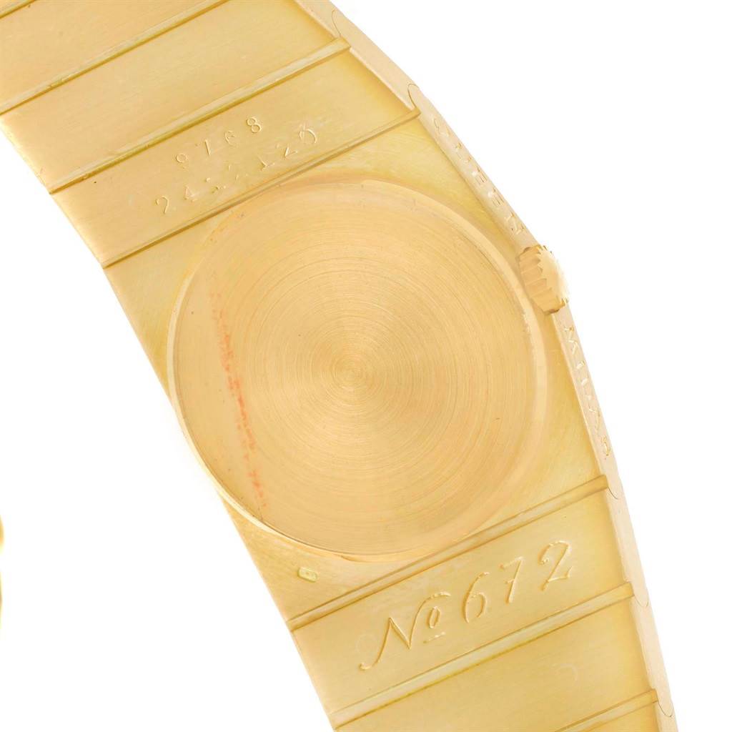 This image shows the backside and part of the bracelet of a Rolex Cellini Women's Yellow Gold Champagne Dial Women's Yellow Gold Champagne Dial watch.