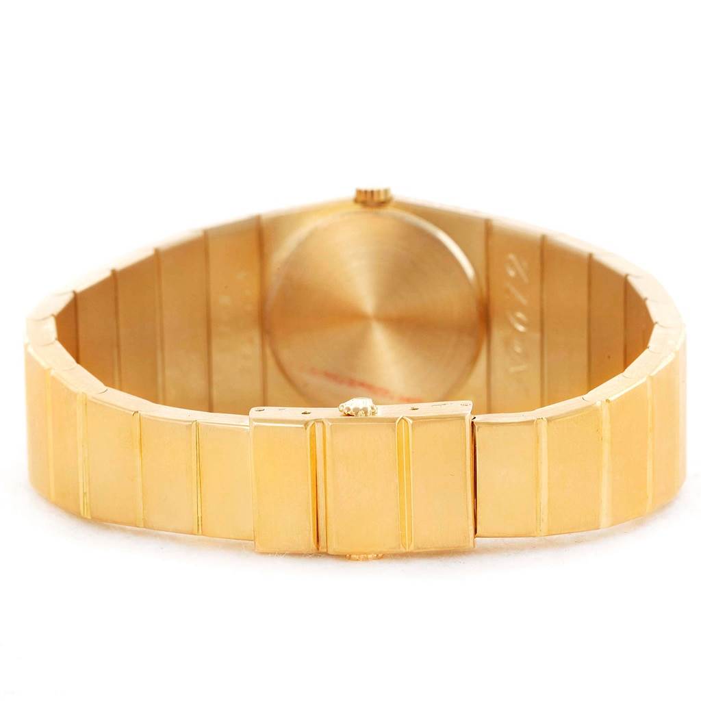 This image shows the bracelet and back case of the Rolex Cellini Women's Yellow Gold Champagne Dial Women's Yellow Gold Champagne Dial model from an overhead angle.