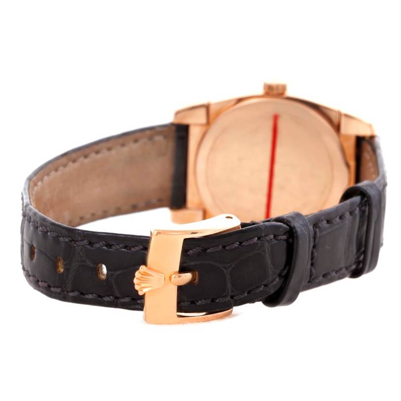 The image shows the back view of a Rolex Cellini 5310 Women's Rose Gold Grey Dial 5310 Women's Rose Gold Grey Dial model watch, highlighting its leather strap and gold buckle.