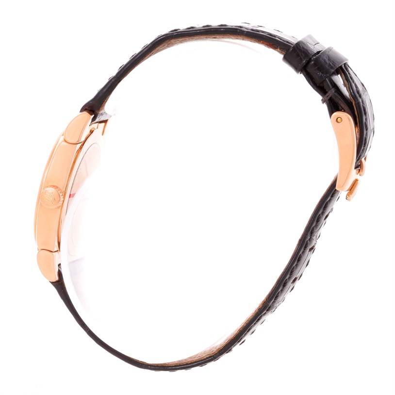 This side-angle view of the Rolex Cellini 5310 Women's Rose Gold Grey Dial 5310 Women's Rose Gold Grey Dial watch showcases the case, crown, and leather strap with a clasp.