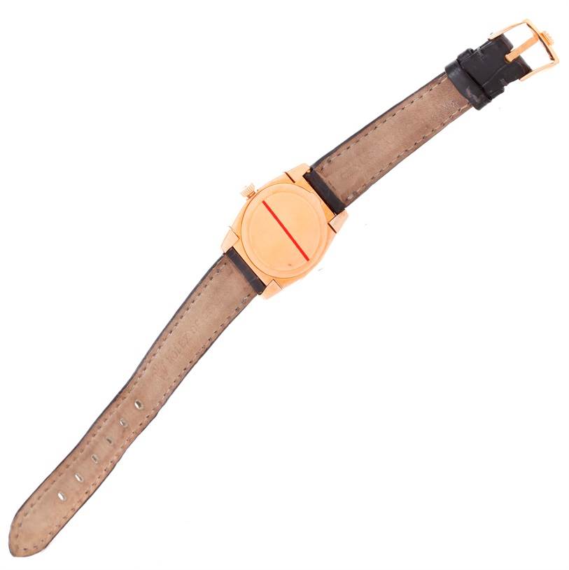 The image shows a top-down view of a Rolex Cellini 5310 Women's Rose Gold Grey Dial 5310 Women's Rose Gold Grey Dial watch, displaying the leather strap, case, and buckle.