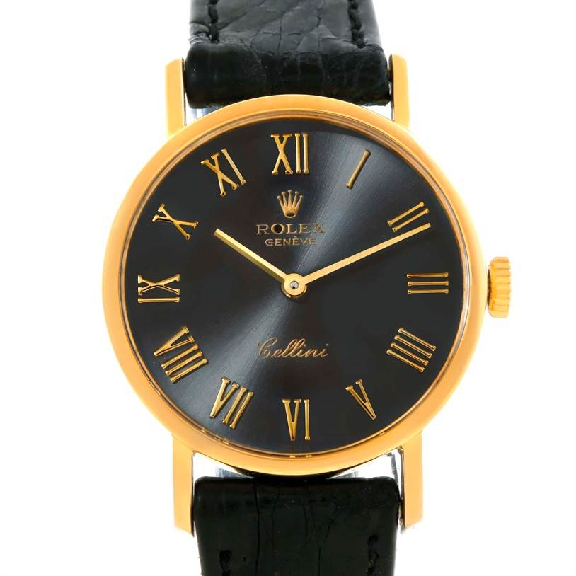 This image shows a frontal view of a Rolex Cellini 5109 Women's Yellow Gold Grey Dial 5109 Women's Yellow Gold Grey Dial watch, highlighting its black dial, gold Roman numerals, and black leather strap.