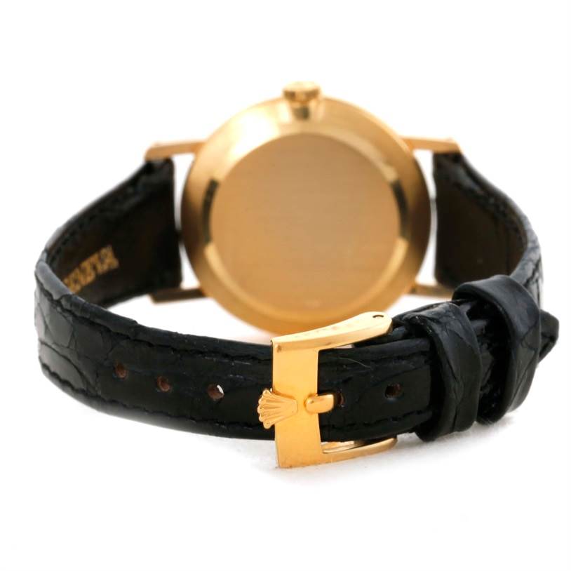 The image shows the back view of a Rolex Cellini 5109 Women's Yellow Gold Grey Dial 5109 Women's Yellow Gold Grey Dial watch, displaying its clasp and leather strap.