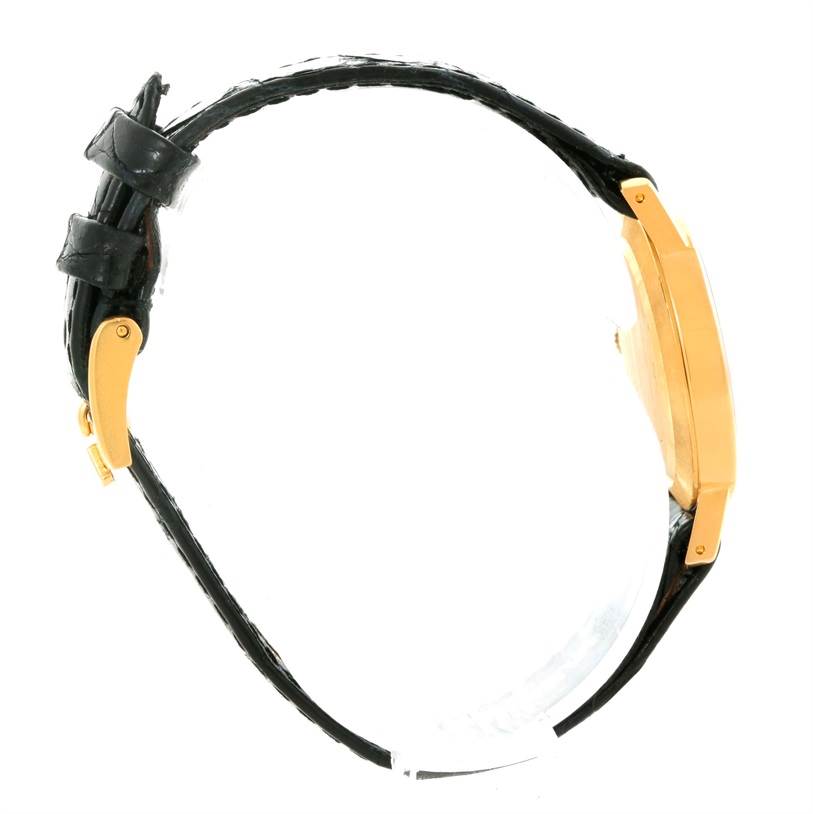 This side-view image of the Rolex Cellini 5109 Women's Yellow Gold Grey Dial 5109 Women's Yellow Gold Grey Dial watch shows the strap and the case.