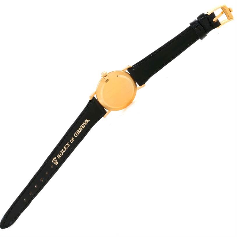 The image shows the back view of a Rolex Cellini 5109 Women's Yellow Gold Grey Dial 5109 Women's Yellow Gold Grey Dial watch, displaying the case back and leather strap.