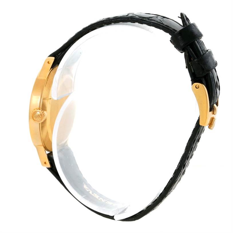 This image shows a side view of the Rolex Cellini 5109 Women's Yellow Gold Grey Dial 5109 Women's Yellow Gold Grey Dial watch featuring its gold case and black leather strap with a gold buckle.