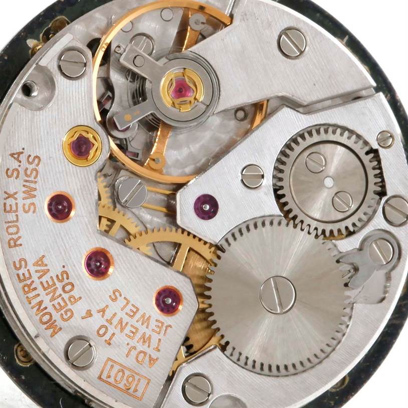 This image shows the intricate inner mechanism of the Rolex Cellini 5109 Women's Yellow Gold Grey Dial 5109 Women's Yellow Gold Grey Dial watch, including gears, jewels, and screws.