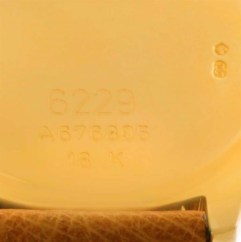 This image shows the engraved case back of a Rolex Cellini 6229 Women's Yellow Gold White Dial 6229 Women's Yellow Gold White Dial model 6229, highlighting its serial number and "18 K" gold mark.