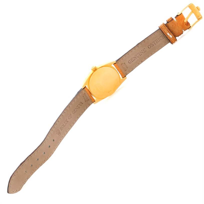 The image shows the back and strap of a Rolex Cellini 6229 Women's Yellow Gold White Dial 6229 Women's Yellow Gold White Dial watch, highlighting the "Genuine Ostrich" leather band.