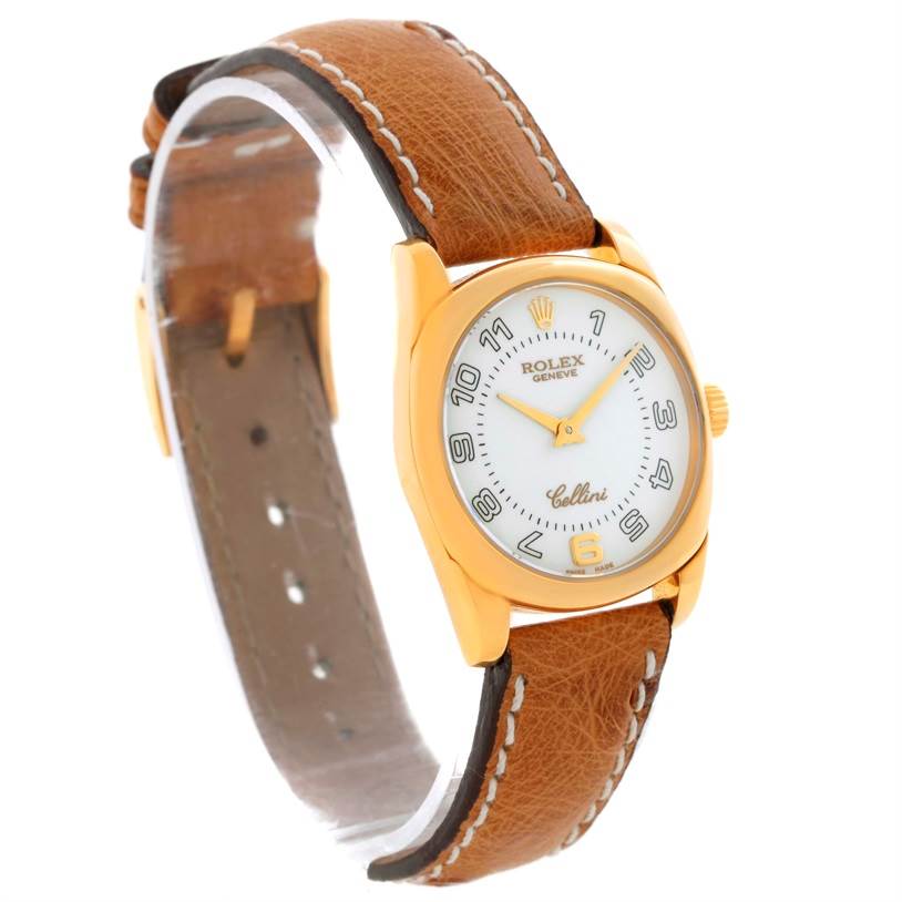 This image shows a side-angle view of the Rolex Cellini 6229 Women's Yellow Gold White Dial 6229 Women's Yellow Gold White Dial watch, featuring its round face, beige leather strap, and gold casing.