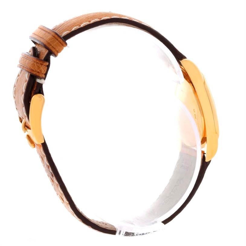 The side view of the Rolex Cellini 6229 Women's Yellow Gold White Dial 6229 Women's Yellow Gold White Dial watch features its golden case and brown leather strap.