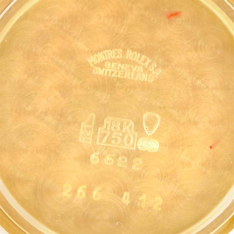 The image shows the inner case back of a Rolex Cellini 6622 Women's Yellow Gold White Dial 6622 Women's Yellow Gold White Dial watch, displaying its engravings and gold hallmark stamps.