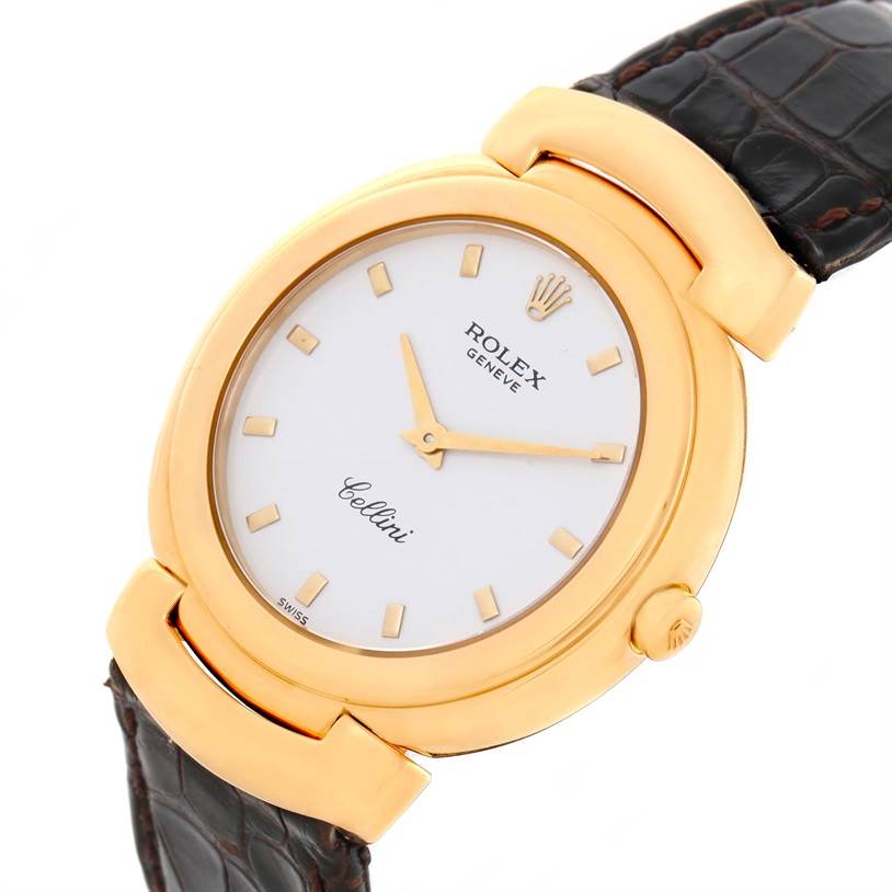 The Rolex Cellini 6622 Women's Yellow Gold White Dial 6622 Women's Yellow Gold White Dial watch is shown from an angled view, highlighting its gold case, crown, white dial, and leather strap.
