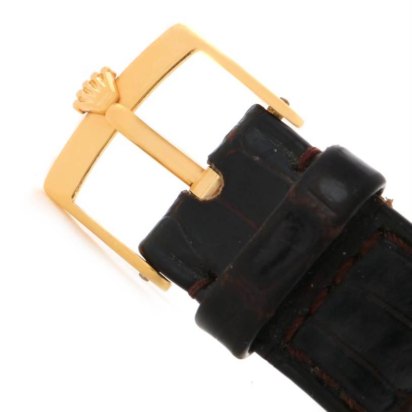 The image shows a close-up of the gold buckle and black leather strap of a Rolex Cellini 6622 Women's Yellow Gold White Dial 6622 Women's Yellow Gold White Dial watch.