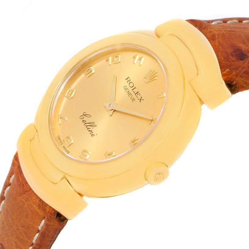 The image shows a close-up angled view of the Rolex Cellini 6621 Women's Yellow Gold Champagne Dial 6621 Women's Yellow Gold Champagne Dial watch face, crown, and part of the leather strap.