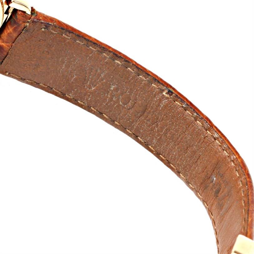 This image shows a close-up of the leather strap of a Rolex Cellini 6621 Women's Yellow Gold Champagne Dial 6621 Women's Yellow Gold Champagne Dial watch and part of its metal clasp.