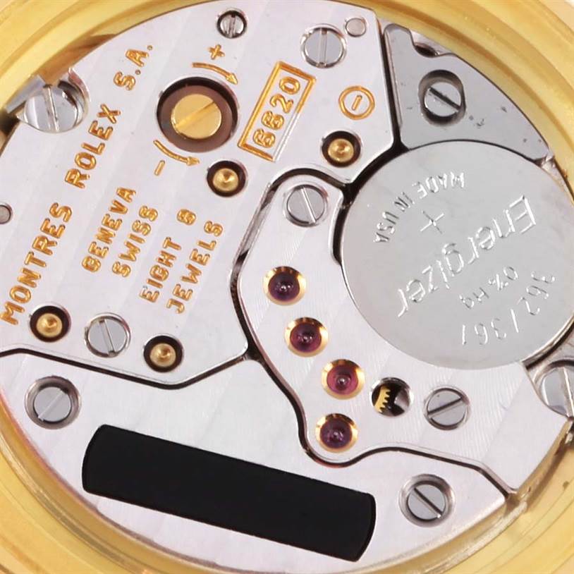 This close-up image shows the internal mechanism of a Cellini model by Rolex, including gears and jewels.