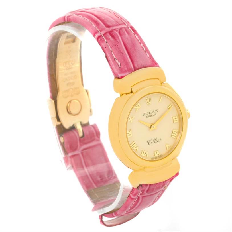The Rolex Cellini 6621 Women's Yellow Gold Beige Dial 6621 Women's Yellow Gold Beige Dial watch is shown at a three-quarter angle, highlighting its pink leather strap and gold case.
