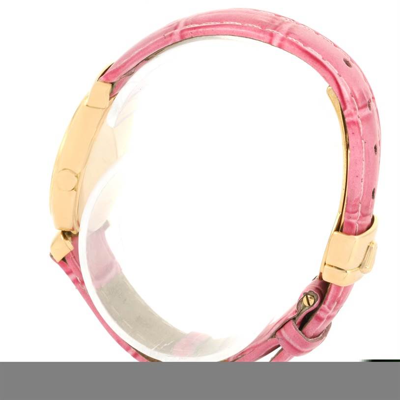 This image shows a side view of a Rolex Cellini 6621 Women's Yellow Gold Beige Dial 6621 Women's Yellow Gold Beige Dial watch, highlighting its pink leather strap and gold clasp.