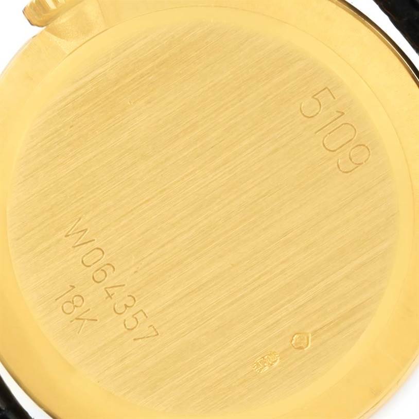 This image shows the engraved serial number and 18K gold marking on the back case of a Rolex Cellini 5109 Women's Yellow Gold Beige Dial 5109 Women's Yellow Gold Beige Dial watch.
