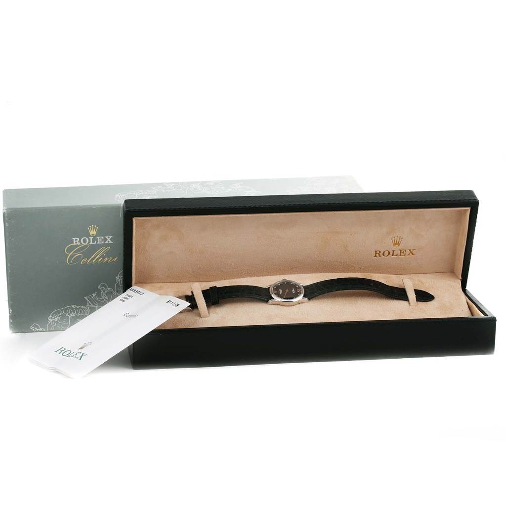 This image shows a Rolex Cellini 6111 Women's White Gold Black Dial 6111 Women's White Gold Black Dial watch in its open box, with the watch displayed flat and a price tag attached.