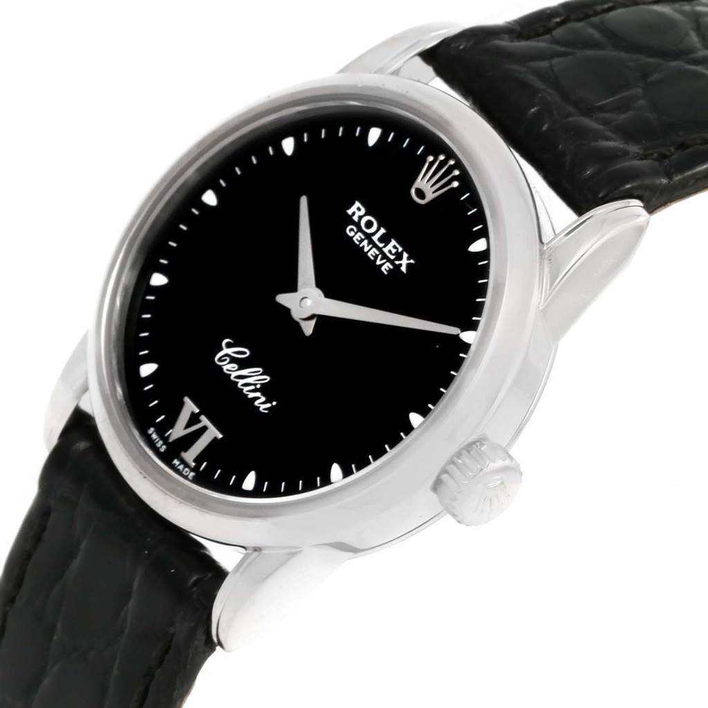 This image shows a Rolex Cellini 6111 Women's White Gold Black Dial 6111 Women's White Gold Black Dial watch angled from the front-side, displaying the face, bezel, and part of the leather strap.
