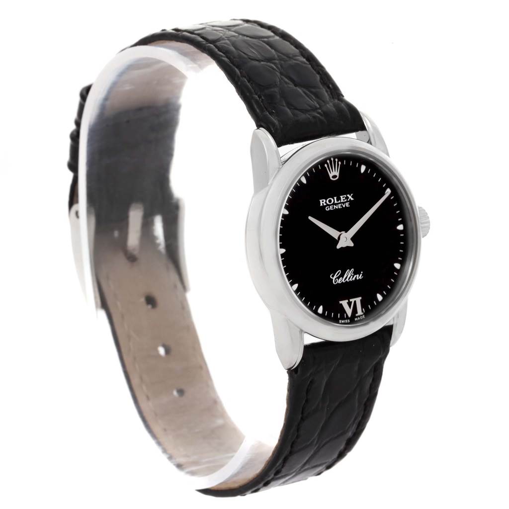 The image shows a tilted side view of a Rolex Cellini 6111 Women's White Gold Black Dial 6111 Women's White Gold Black Dial watch, highlighting its black leather strap and black dial.