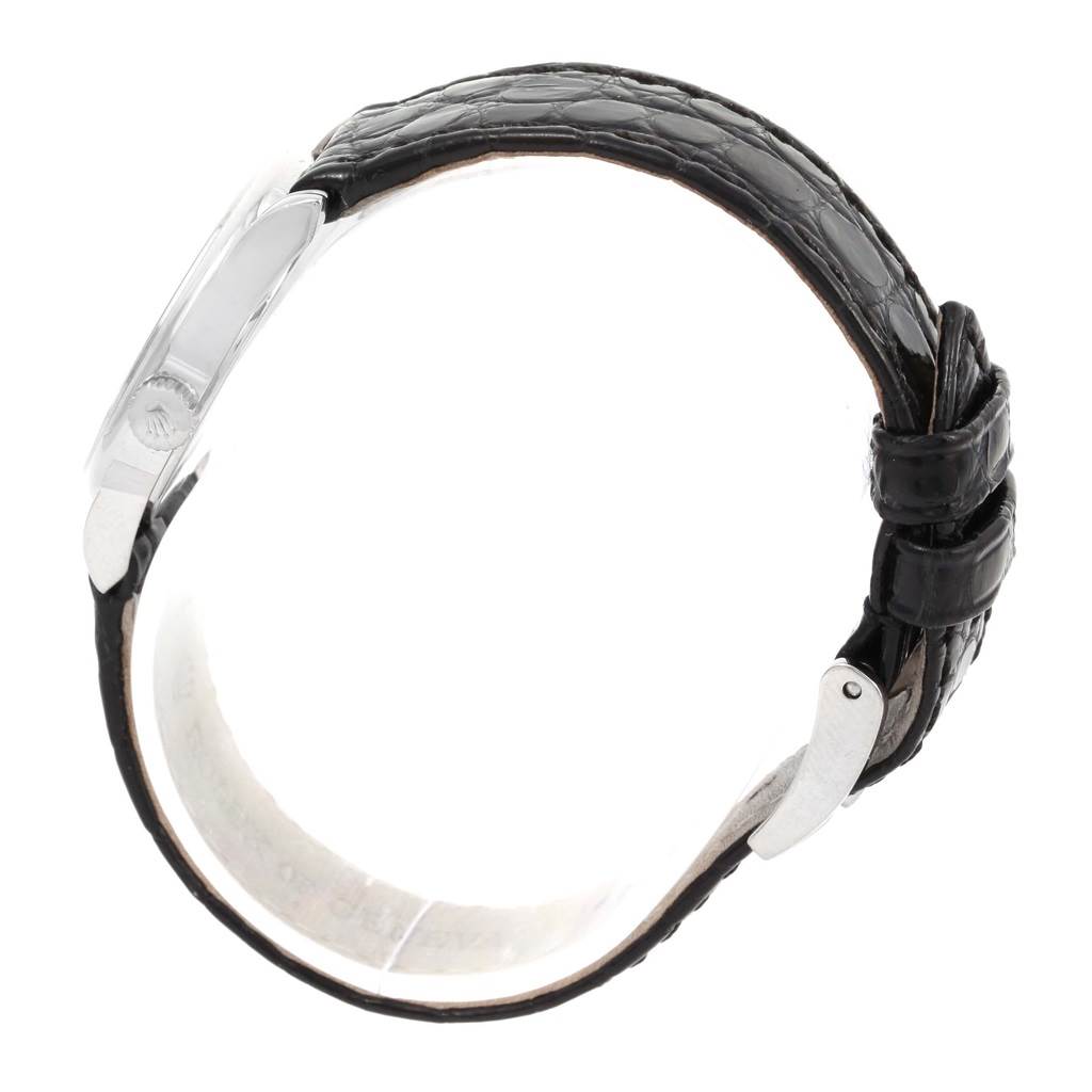 The image shows a side view of a Rolex Cellini 6111 Women's White Gold Black Dial 6111 Women's White Gold Black Dial watch, highlighting its black leather strap and clasp.