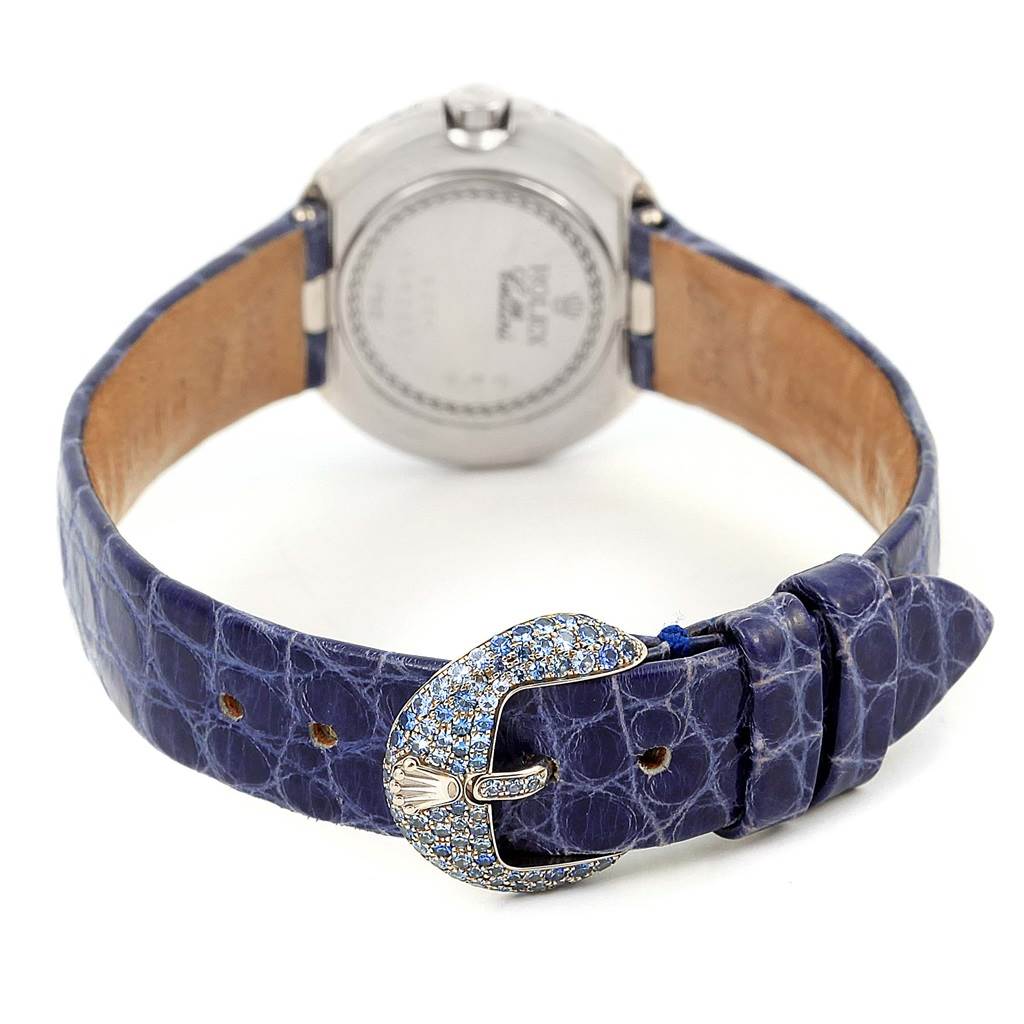 This image shows the back view of a Rolex Cellini 6201 Women's White Gold Mother of Pearl Dial 6201 Women's White Gold Mother of Pearl Dial watch, featuring a blue textured leather strap with a jeweled buckle.