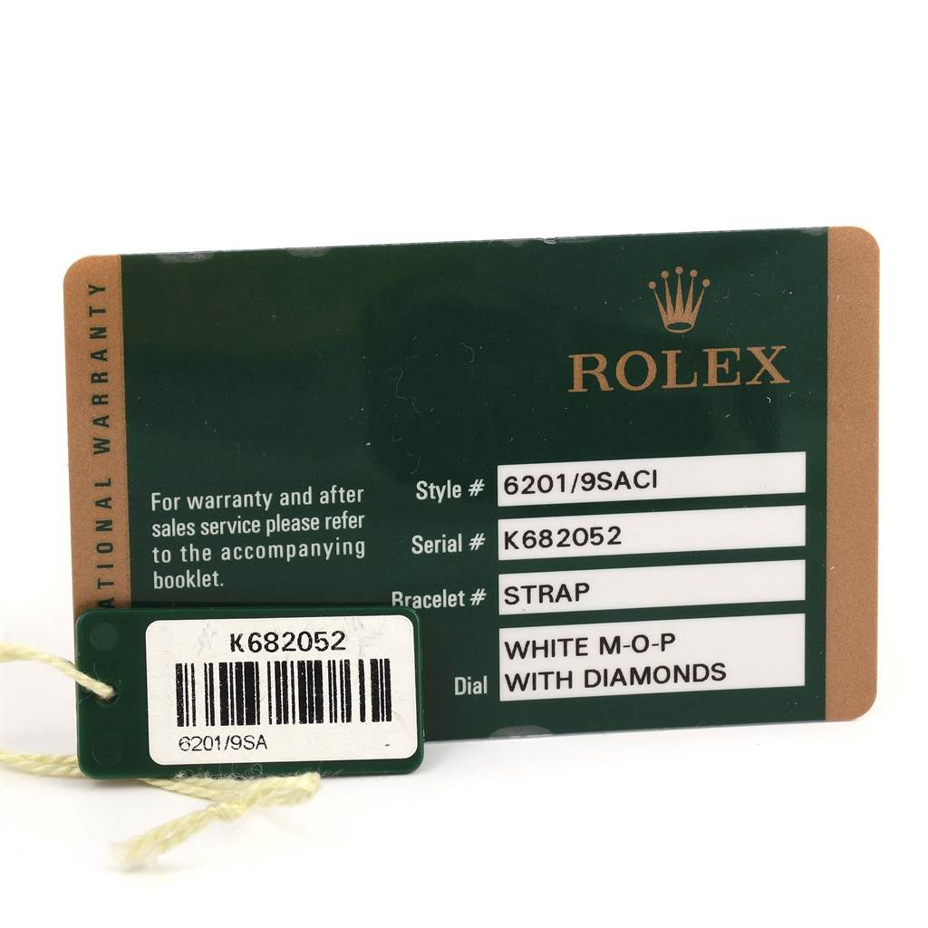 The image shows warranty and serial number cards for a Rolex Cellini 6201 Women's White Gold Mother of Pearl Dial 6201 Women's White Gold Mother of Pearl Dial model watch, displaying its specifications.