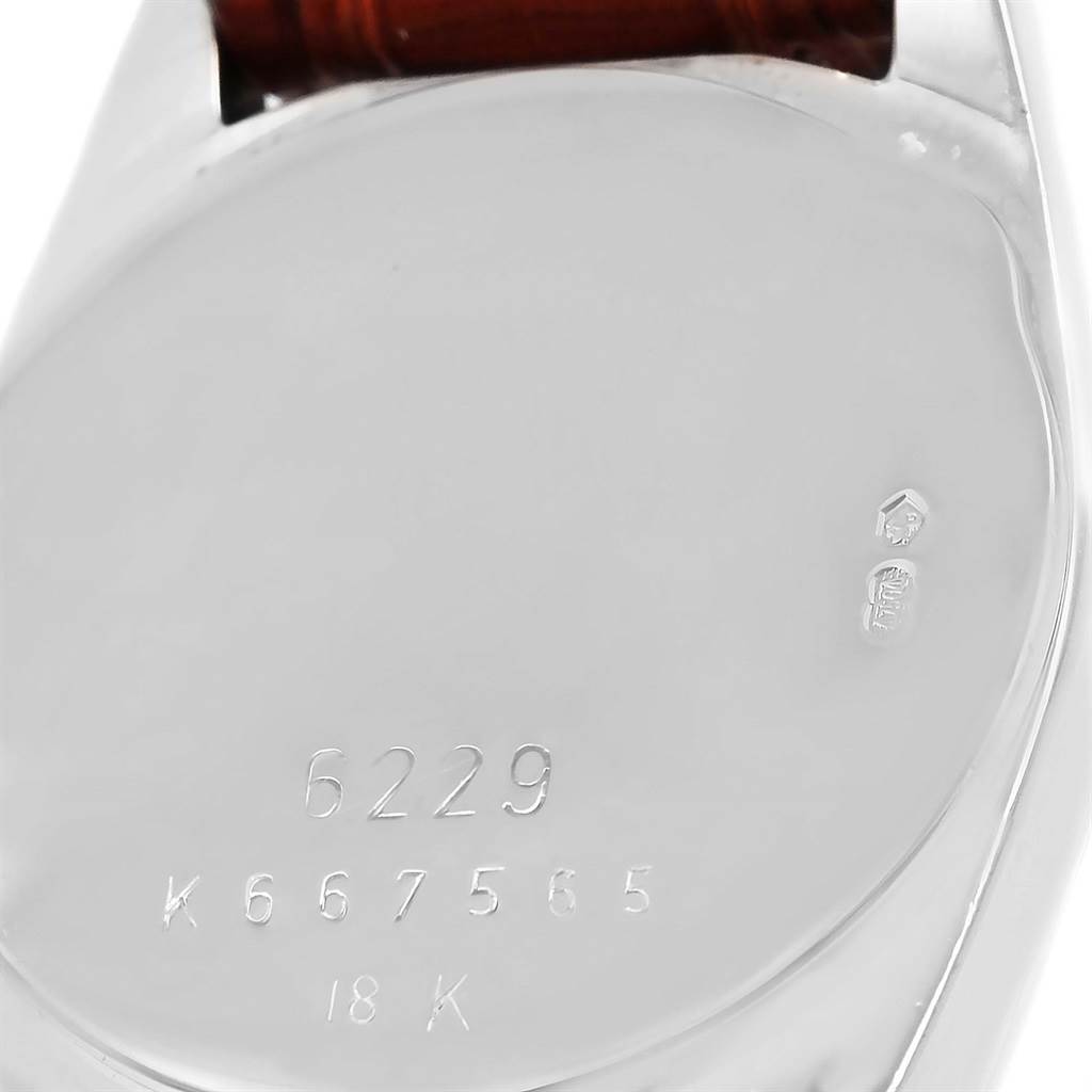 The image shows the back case of a Rolex Cellini 6229 Women's White Gold Black Dial 6229 Women's White Gold Black Dial watch, highlighting its engravings and hallmarks.