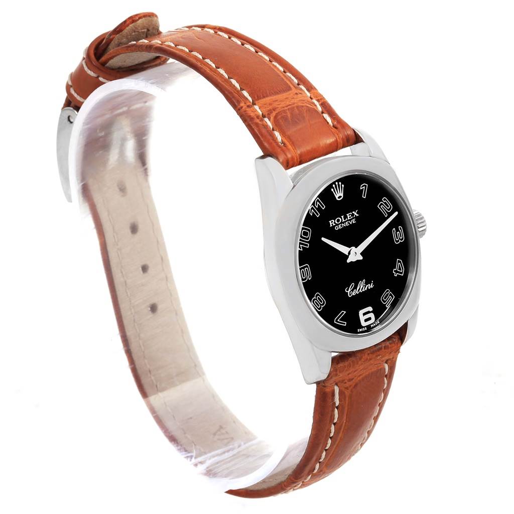 The Rolex Cellini 6229 Women's White Gold Black Dial 6229 Women's White Gold Black Dial model watch is shown at a three-quarter angle, featuring its black dial, case, and brown leather strap.