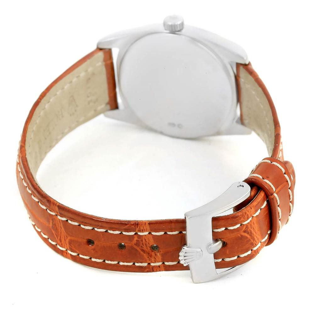 This Rolex Cellini 6229 Women's White Gold Black Dial 6229 Women's White Gold Black Dial watch is shown from the back, displaying its brown leather strap and polished silver buckle.