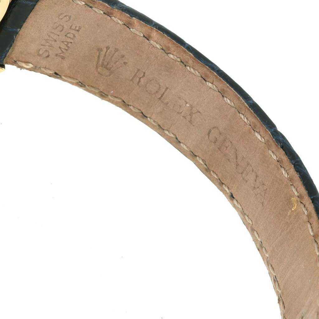 The image shows a close-up of the leather strap with branding for the Rolex Cellini 6621 Women's Yellow Gold White Dial 6621 Women's Yellow Gold White Dial watch.