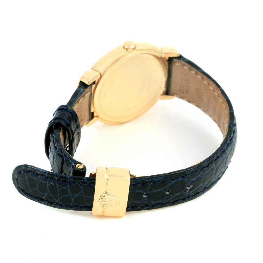 This image shows the back view of a Rolex Cellini 6621 Women's Yellow Gold White Dial 6621 Women's Yellow Gold White Dial watch, highlighting its gold case and black leather strap with a gold clasp.