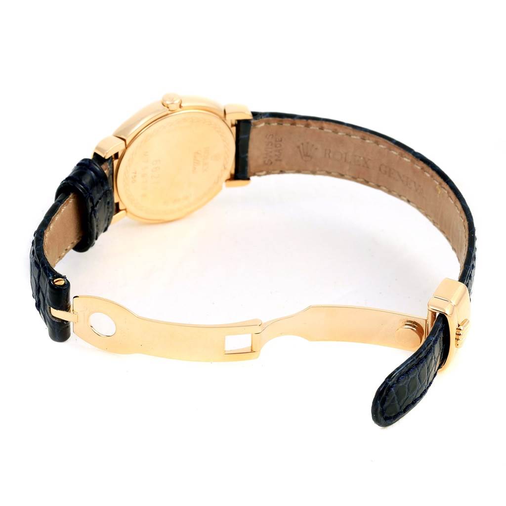 The image shows the back and clasp of a Rolex Cellini 6621 Women's Yellow Gold White Dial 6621 Women's Yellow Gold White Dial watch with a black leather strap and gold casing.