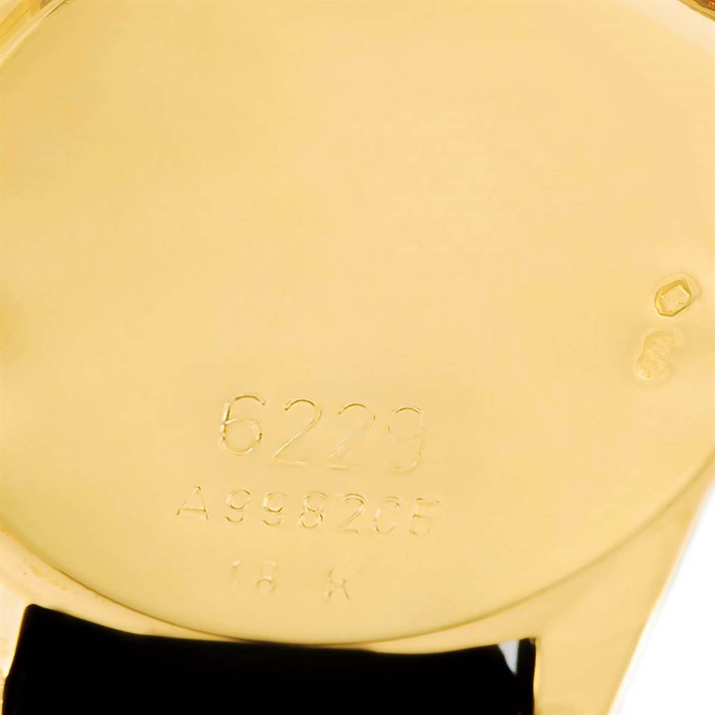 This image shows the back case of a Rolex Cellini 6229 Women's Yellow Gold Black Dial 6229 Women's Yellow Gold Black Dial watch, displaying its engraved model and serial numbers.
